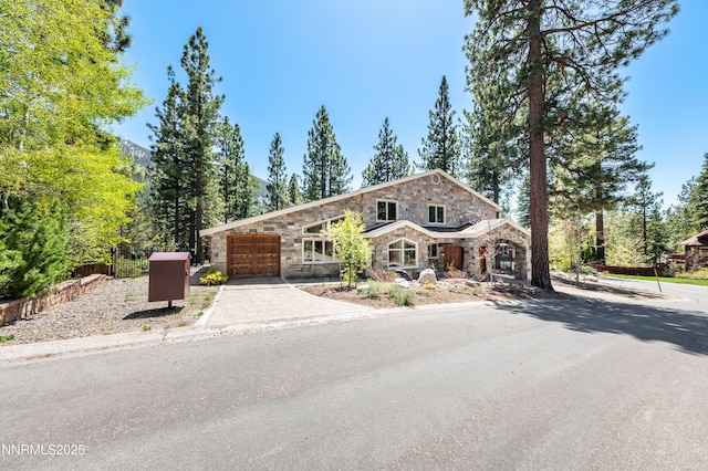 143 Granite Springs Dr, Stateline, NV 89449 - view of front of property with stone siding, an attached garage, and concrete driveway