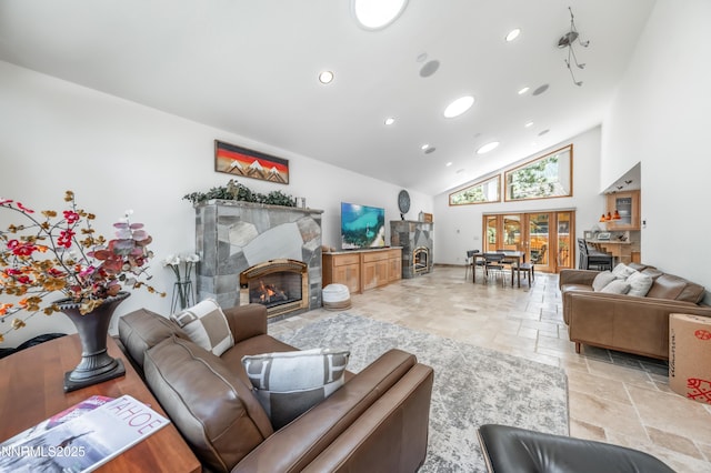 143 Granite Springs Dr, Stateline, NV 89449 - living area featuring stone tile floors, a tile fireplace, high vaulted ceiling, and recessed lighting