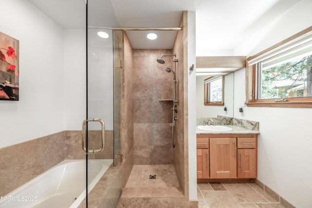 143 Granite Springs Dr, Stateline, NV 89449 - full bathroom featuring a stall shower, vanity, a bath, and stone finish flooring