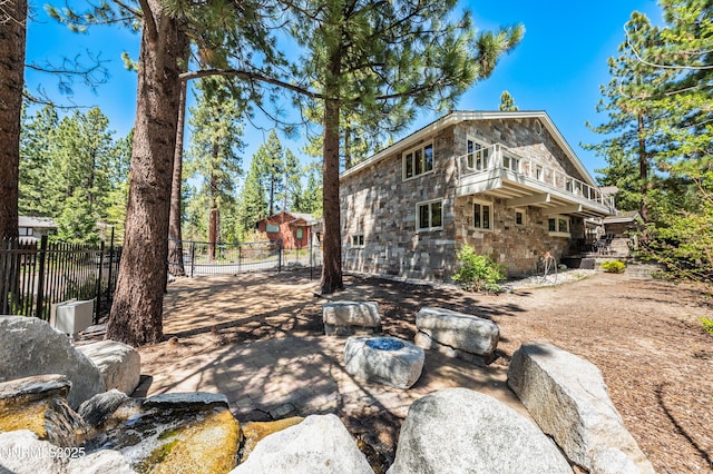143 Granite Springs Dr, Stateline, NV 89449 - view of home's exterior with stone siding and a patio area