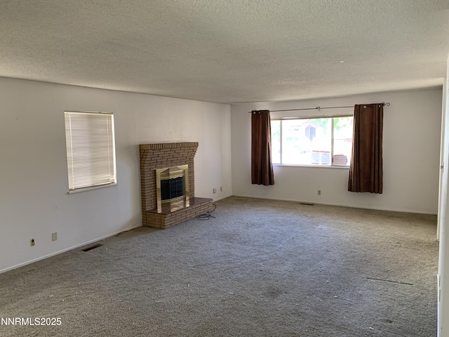 650 John Fremont Dr, Reno, NV 89509 - unfurnished living room featuring a textured ceiling, a brick fireplace, and carpet flooring