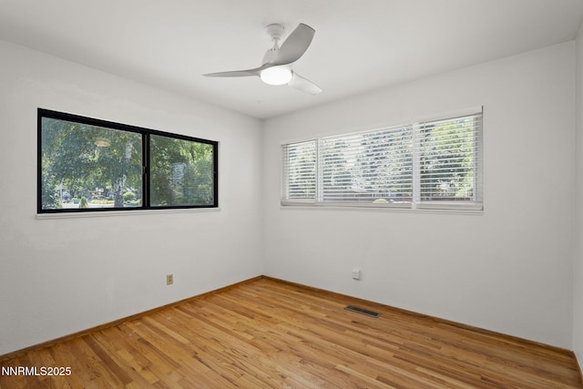 633 Crain St, Carson City, NV 89703 - empty room featuring light wood finished floors, a ceiling fan, and baseboards