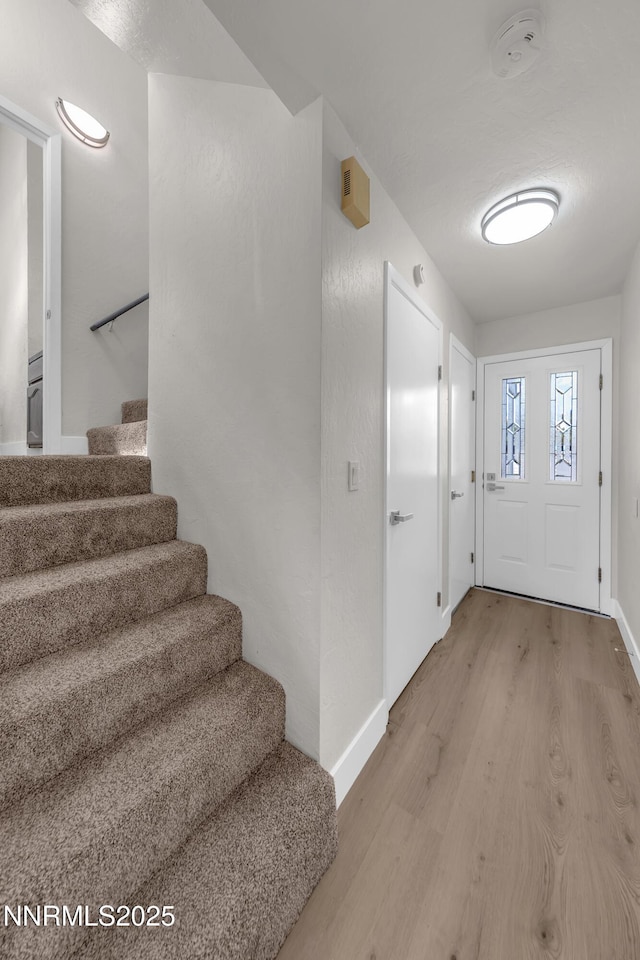 2501 Garfield Ct, Sparks, NV 89431 - foyer with light wood-style floors, stairs, and baseboards