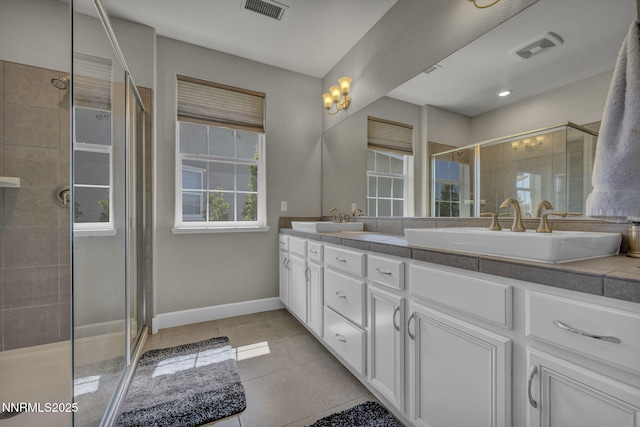 1940 Dark Horse Rd Unit C, Reno, NV 89521 - bathroom with double vanity, a shower stall, tile patterned floors, and baseboards