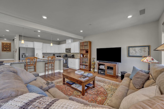 1940 Dark Horse Rd Unit C, Reno, NV 89521 - living area with light wood finished floors, recessed lighting, baseboards, and beam ceiling