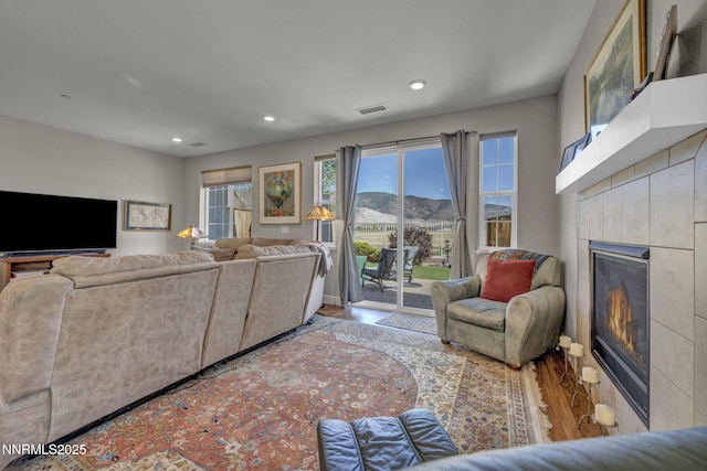 1940 Dark Horse Rd Unit C, Reno, NV 89521 - living area featuring a tile fireplace, wood finished floors, recessed lighting, and a mountain view