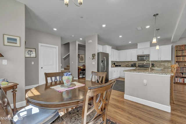1940 Dark Horse Rd Unit C, Reno, NV 89521 - dining area with stairway, light wood-type flooring, recessed lighting, and baseboards