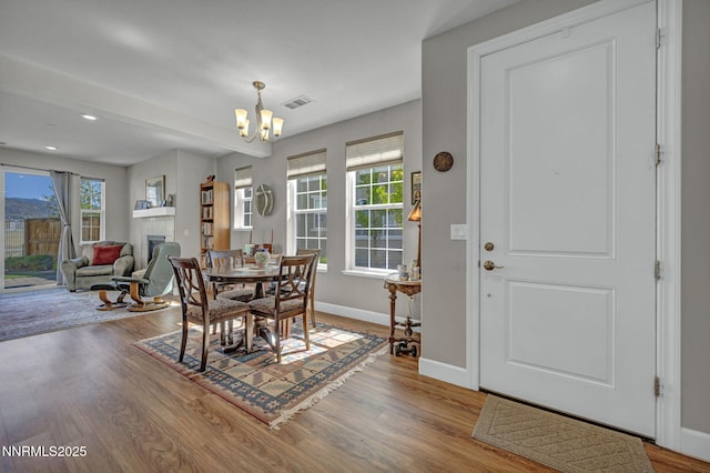 1940 Dark Horse Rd Unit C, Reno, NV 89521 - dining room with a chandelier, wood finished floors, baseboards, healthy amount of natural light, and recessed lighting