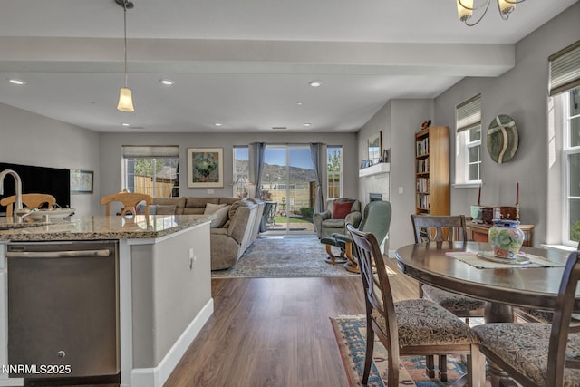 1940 Dark Horse Rd Unit C, Reno, NV 89521 - kitchen with dishwasher, recessed lighting, dark wood finished floors, open floor plan, and light stone countertops