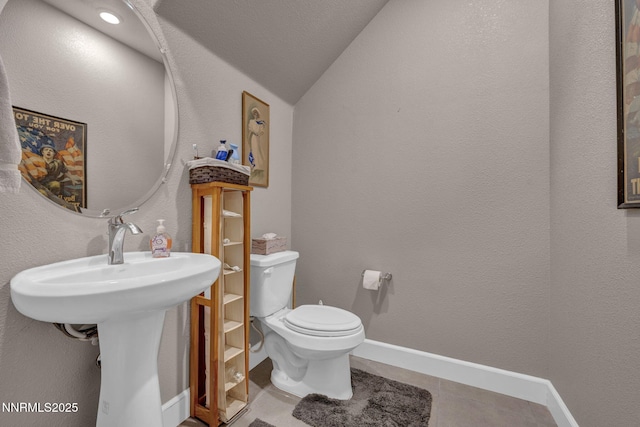 1940 Dark Horse Rd Unit C, Reno, NV 89521 - half bathroom featuring lofted ceiling, toilet, and baseboards