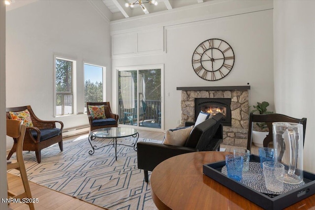807 Alder Ave Unit 10, Incline Village, NV 89451 - living area featuring a baseboard radiator, wood finished floors, a fireplace, and beamed ceiling