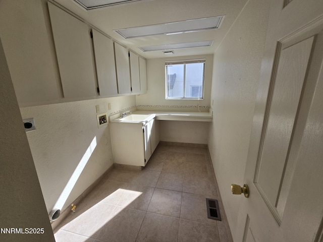 986 Quail Hollow Dr, Reno, NV 89511 - washroom featuring electric dryer hookup, cabinet space, washer hookup, baseboards, and light tile patterned flooring