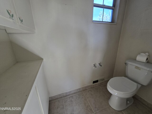 986 Quail Hollow Dr, Reno, NV 89511 - bathroom with toilet, baseboards, and tile patterned flooring