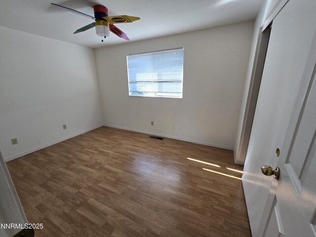 986 Quail Hollow Dr, Reno, NV 89511 - unfurnished bedroom featuring wood finished floors, a closet, ceiling fan, and baseboards