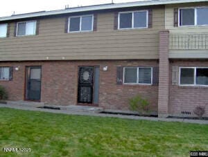 528 Smithridge Park, Reno, NV 89502 - back of property featuring brick siding and a lawn
