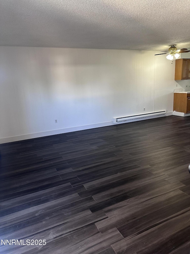 528 Smithridge Park, Reno, NV 89502 - spare room with a baseboard radiator, ceiling fan, dark wood-style floors, baseboards, and a textured ceiling