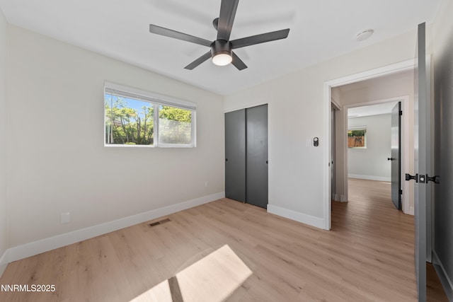 583 Marta Way, Reno, NV 89503 - unfurnished bedroom with baseboards, light wood-style floors, a closet, and ceiling fan