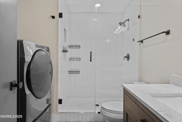 583 Marta Way, Reno, NV 89503 - bathroom featuring washer / clothes dryer, toilet, vanity, and a shower stall
