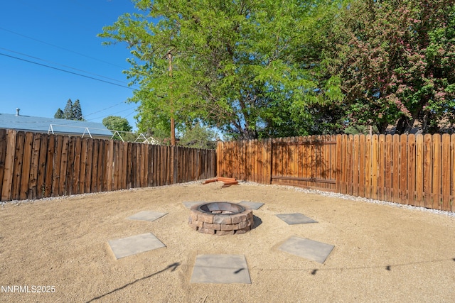 583 Marta Way, Reno, NV 89503 - fenced backyard featuring a fire pit