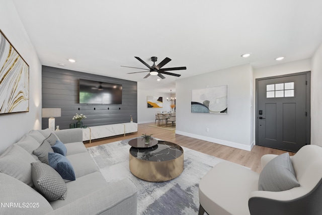 583 Marta Way, Reno, NV 89503 - living room with a ceiling fan, wood finished floors, baseboards, recessed lighting, and wooden walls