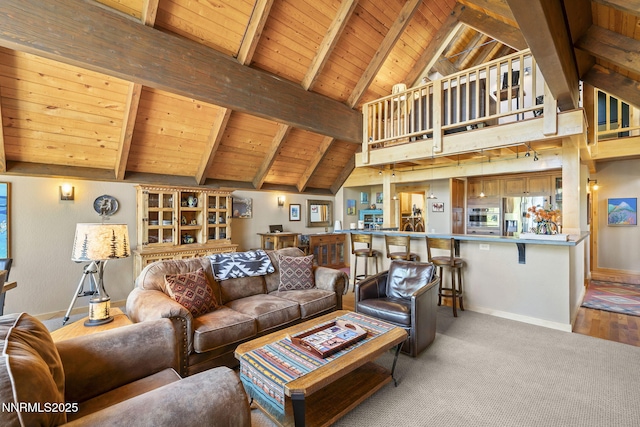 968 Pyrite Ct, Incline Village, NV 89451 - living room with baseboards, wooden ceiling with exposed beams, high vaulted ceiling, and carpet flooring