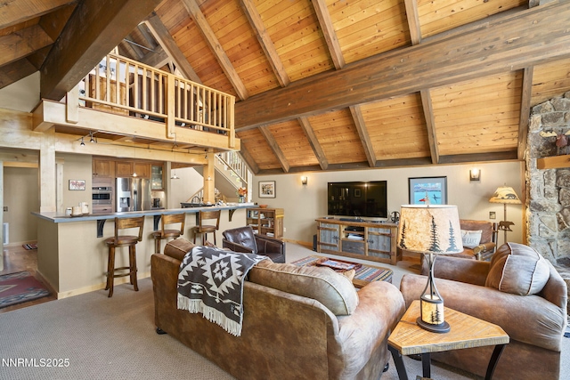968 Pyrite Ct, Incline Village, NV 89451 - carpeted living room featuring wooden ceiling with exposed beams, baseboards, high vaulted ceiling, and stairs