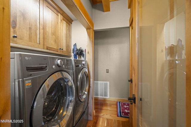 968 Pyrite Ct, Incline Village, NV 89451 - washroom with washing machine and dryer, wood finished floors, cabinet space, and baseboards