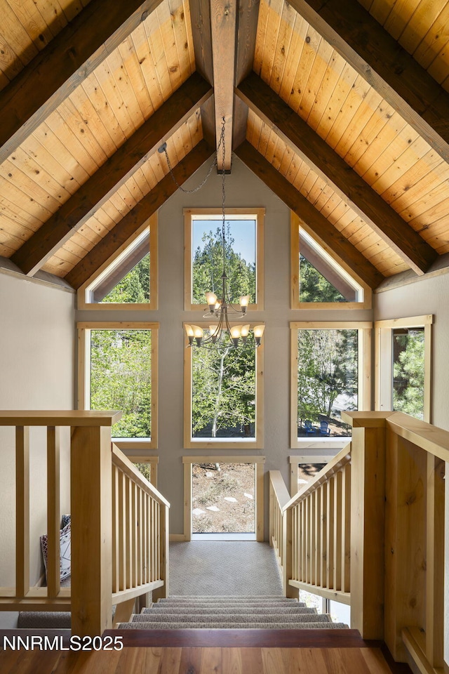968 Pyrite Ct, Incline Village, NV 89451 - staircase featuring a chandelier, wooden ceiling with exposed beams, wood finished floors, and high vaulted ceiling