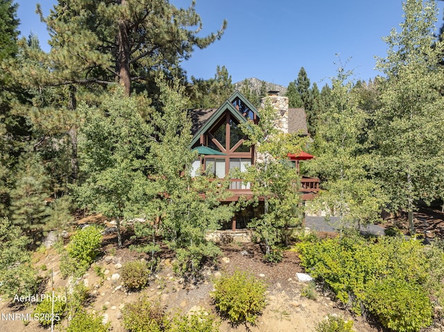 968 Pyrite Ct, Incline Village, NV 89451 - view of front of property with a chimney and a wooden deck