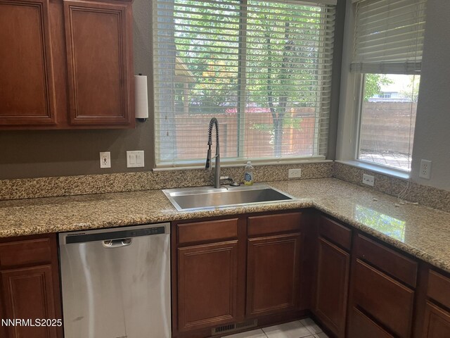 5619 Crescent Hill Way, Sparks, NV 89436 - kitchen featuring stainless steel dishwasher, a sink, and brown cabinets
