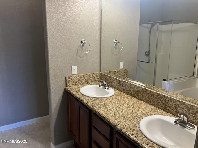 5619 Crescent Hill Way, Sparks, NV 89436 - full bath with double vanity, a shower with door, baseboards, and a textured wall