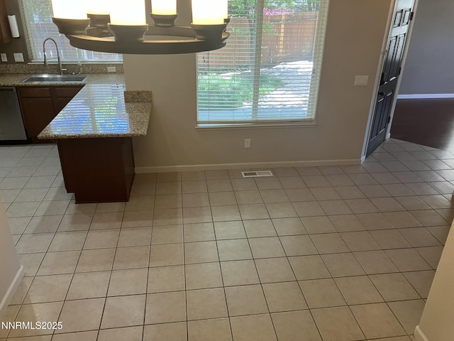 5619 Crescent Hill Way, Sparks, NV 89436 - kitchen featuring a sink, stainless steel dishwasher, and baseboards