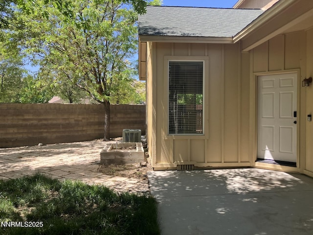 5619 Crescent Hill Way, Sparks, NV 89436 - entrance to property with board and batten siding, a patio, and roof with shingles