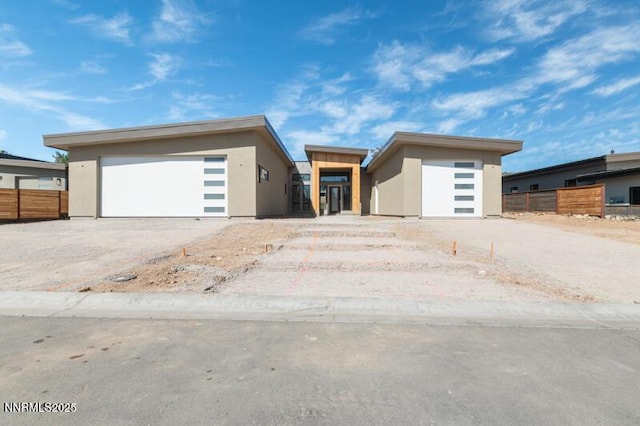 2531 Meraki Pl, Reno, NV 89509 - contemporary house featuring stucco siding, an outbuilding, and a garage