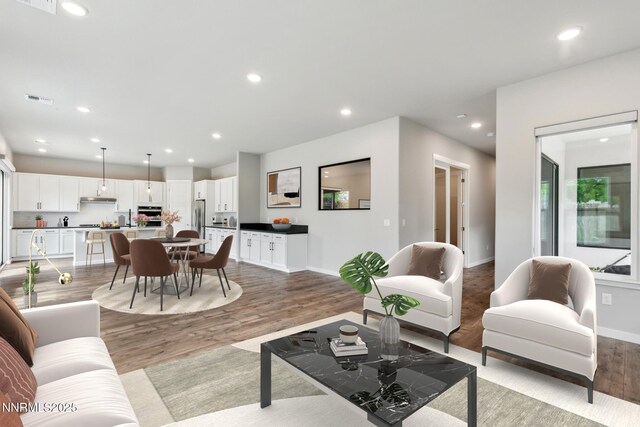 9621 Lane Garrett Dr, Reno, NV 89511 - living area featuring light wood finished floors, baseboards, and recessed lighting