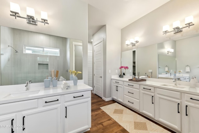 9621 Lane Garrett Dr, Reno, NV 89511 - full bathroom with vanity, walk in shower, and wood finished floors