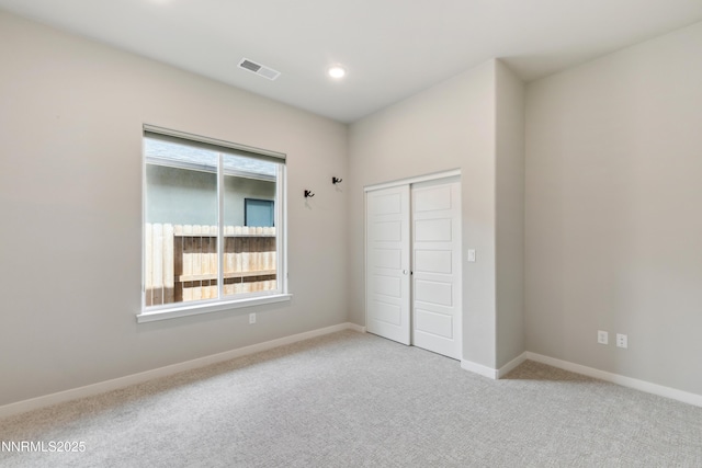 9621 Lane Garrett Dr, Reno, NV 89511 - unfurnished bedroom featuring light colored carpet, a closet, baseboards, and recessed lighting