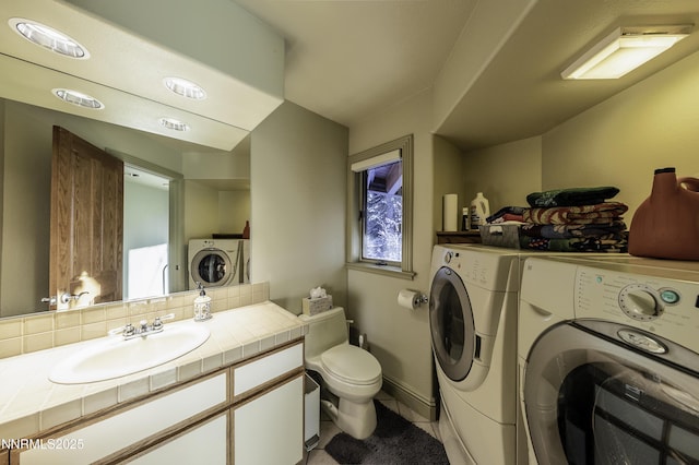 124 Delissa Ct, Stateline, NV 89449 - laundry area with washing machine and dryer and light tile patterned floors