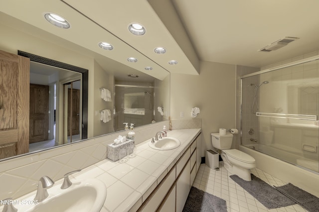 124 Delissa Ct, Stateline, NV 89449 - bathroom featuring double vanity, toilet, combined bath / shower with glass door, tile patterned flooring, and recessed lighting
