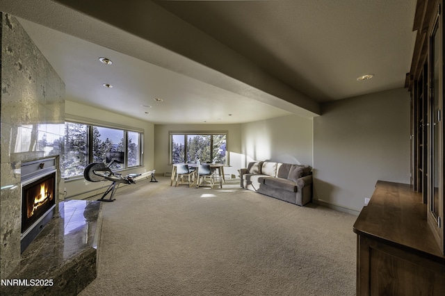 124 Delissa Ct, Stateline, NV 89449 - living room with carpet, a lit fireplace, recessed lighting, and baseboards