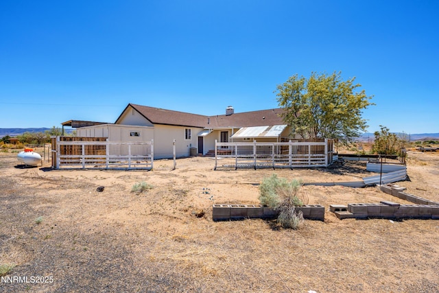 1260 Badger St, Silver Springs, NV 89429 - back of property with a chimney