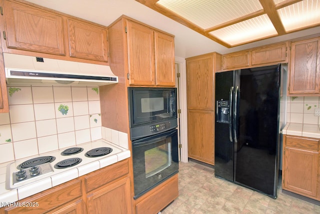 1664 Shadow Wood Rd, Reno, NV 89523 - kitchen featuring black appliances, tile countertops, under cabinet range hood, and tasteful backsplash