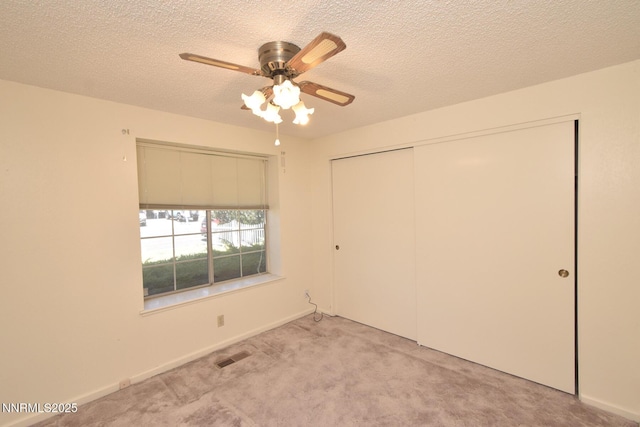 1664 Shadow Wood Rd, Reno, NV 89523 - unfurnished bedroom featuring light carpet, a closet, a textured ceiling, and a ceiling fan