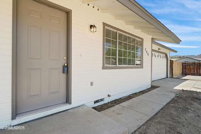 266 River Boat Rd, Dayton, NV 89403 - doorway to property with concrete driveway and a garage