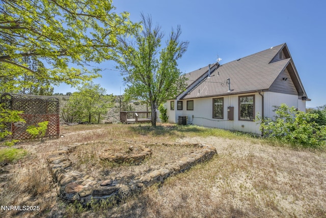 670 Valle Verde Dr, Sparks, NV 89441 - view of yard featuring central AC unit and a wooden deck