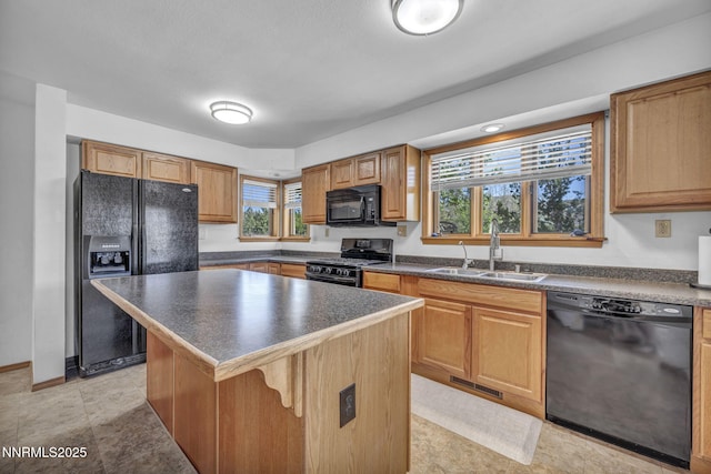 670 Valle Verde Dr, Sparks, NV 89441 - kitchen with black appliances, a sink, dark countertops, and a center island