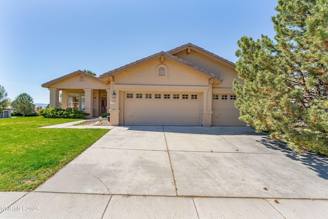 7100 Heatherwood Dr, Reno, NV 89523 - view of front of property with an attached garage, driveway, and a front yard
