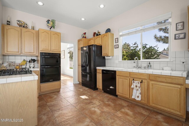7100 Heatherwood Dr, Reno, NV 89523 - kitchen with black appliances, a sink, light brown cabinetry, and recessed lighting