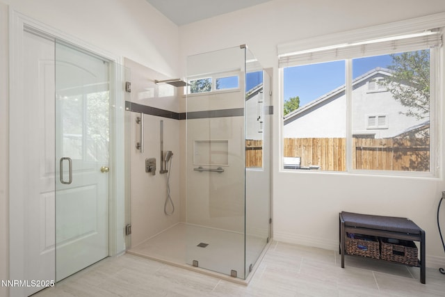 7100 Heatherwood Dr, Reno, NV 89523 - bathroom featuring a stall shower and baseboards