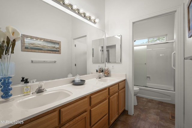7100 Heatherwood Dr, Reno, NV 89523 - bathroom featuring double vanity, toilet, combined bath / shower with glass door, and tile patterned floors